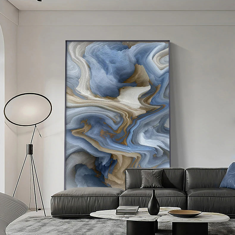 Modern living room with a large abstract painting on the wall, a gray sofa, and a floor lamp.