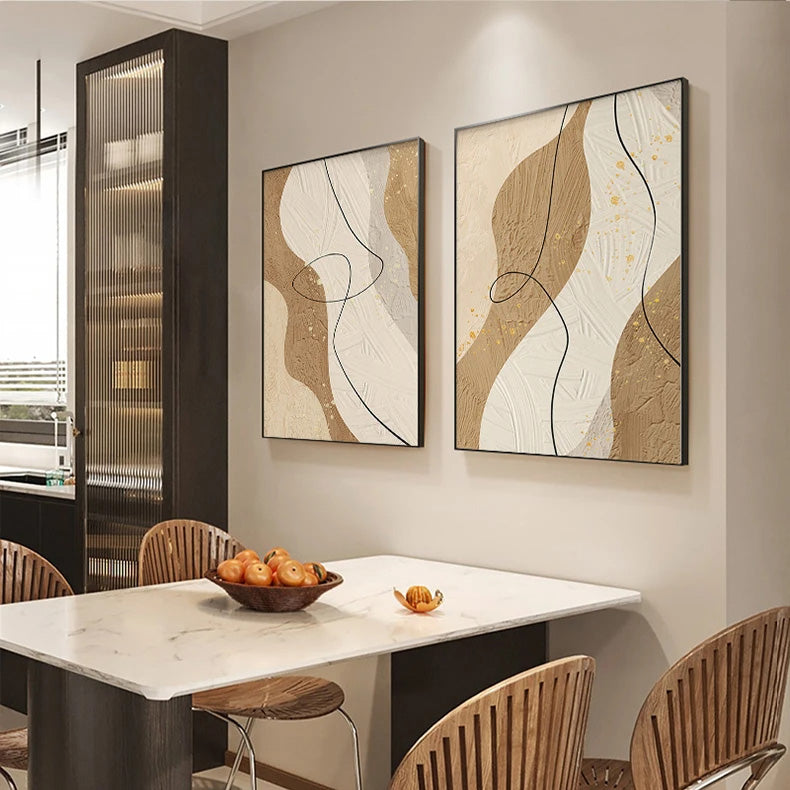 Dining room with marble table, wooden chairs, and abstract wall art.