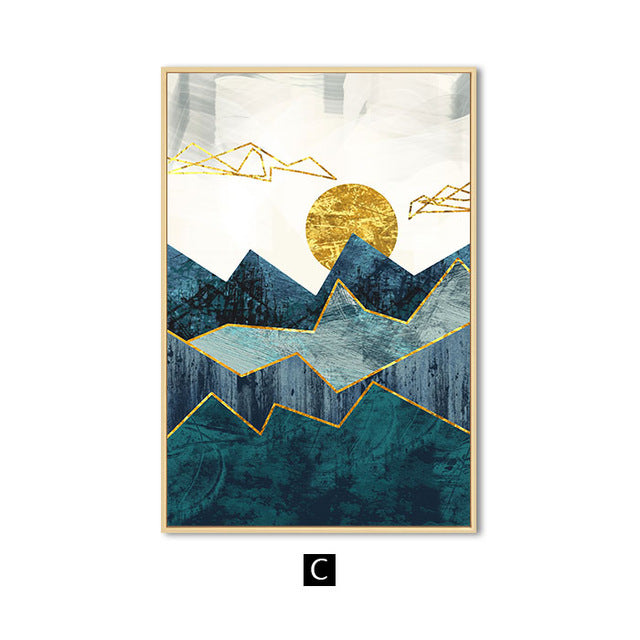 A set of three canvas prints featuring an abstract mountain landscape with blue, green, and golden colors, displayed above a grey sofa with decorative pillows.