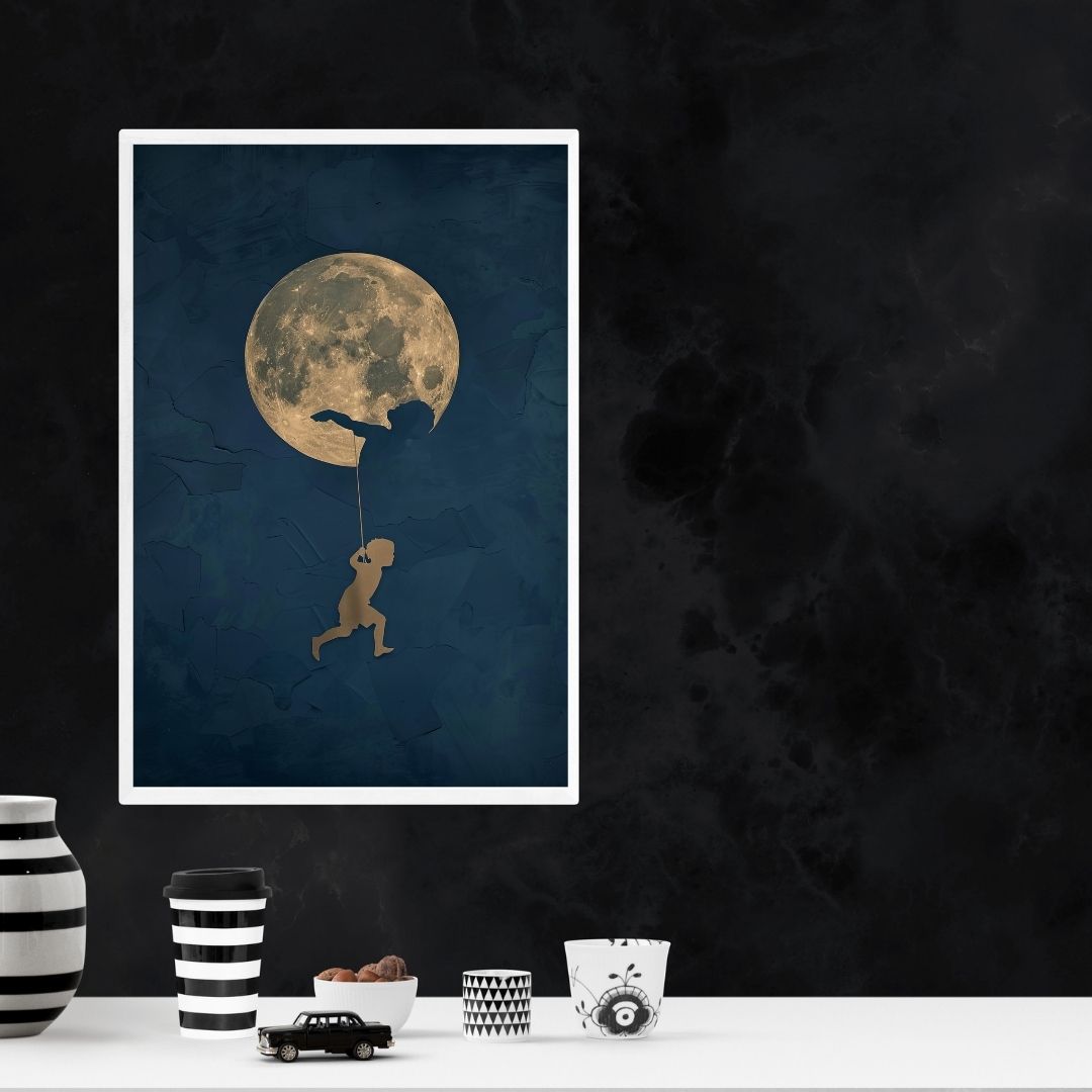 Framed artwork of a silhouette against a moonlit sky on a dark wall with decorative items below.