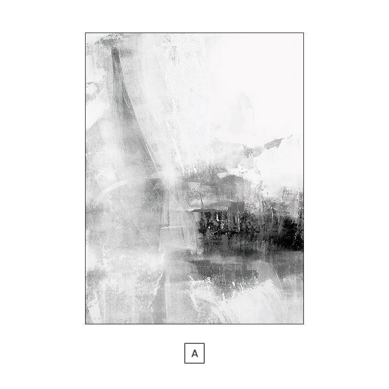 Two black and white abstract canvas prints hanging on a wall above a grey sofa with decorative pillows, a coffee table, and a decorative plant.