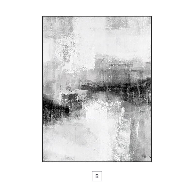 Two black and white abstract canvas prints hanging on a wall above a grey sofa with decorative pillows, a coffee table, and a decorative plant.