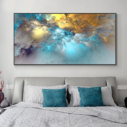 A large abstract blue and gold cloud canvas wall art print displayed in a modern bedroom setting with a stylish azure cushion cover decor.