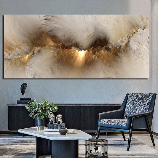 A large abstract grey and gold cloud canvas wall art displayed in a modern living room setting with a stylish chair and table.