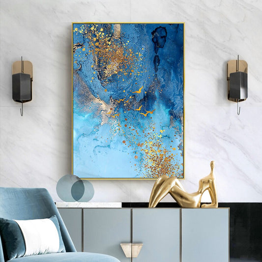A canvas print featuring an abstract golden blue sea marble design, displayed above a cabinet in a room with modern interior decor.