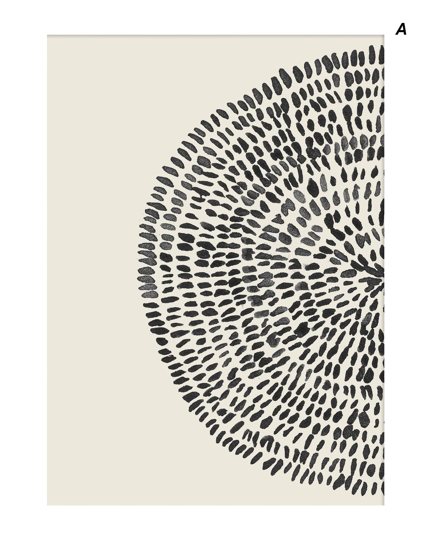 Two canvas wall art prints with a geometric dot circle abstract pattern displayed above a wooden bench in a minimalist interior setting.