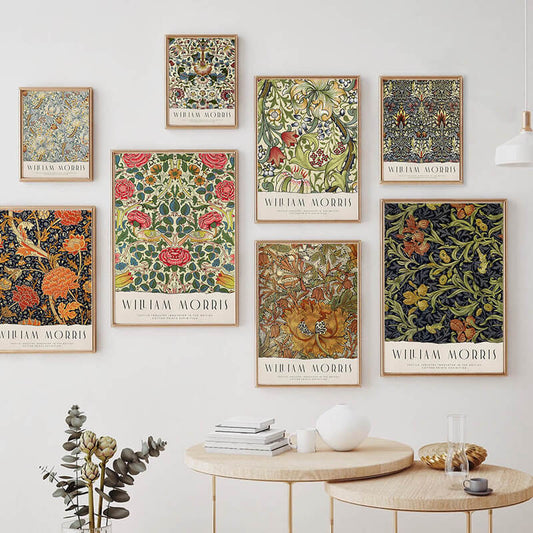 Posters for a William Morris exhibition featuring intricate floral and foliage patterns.