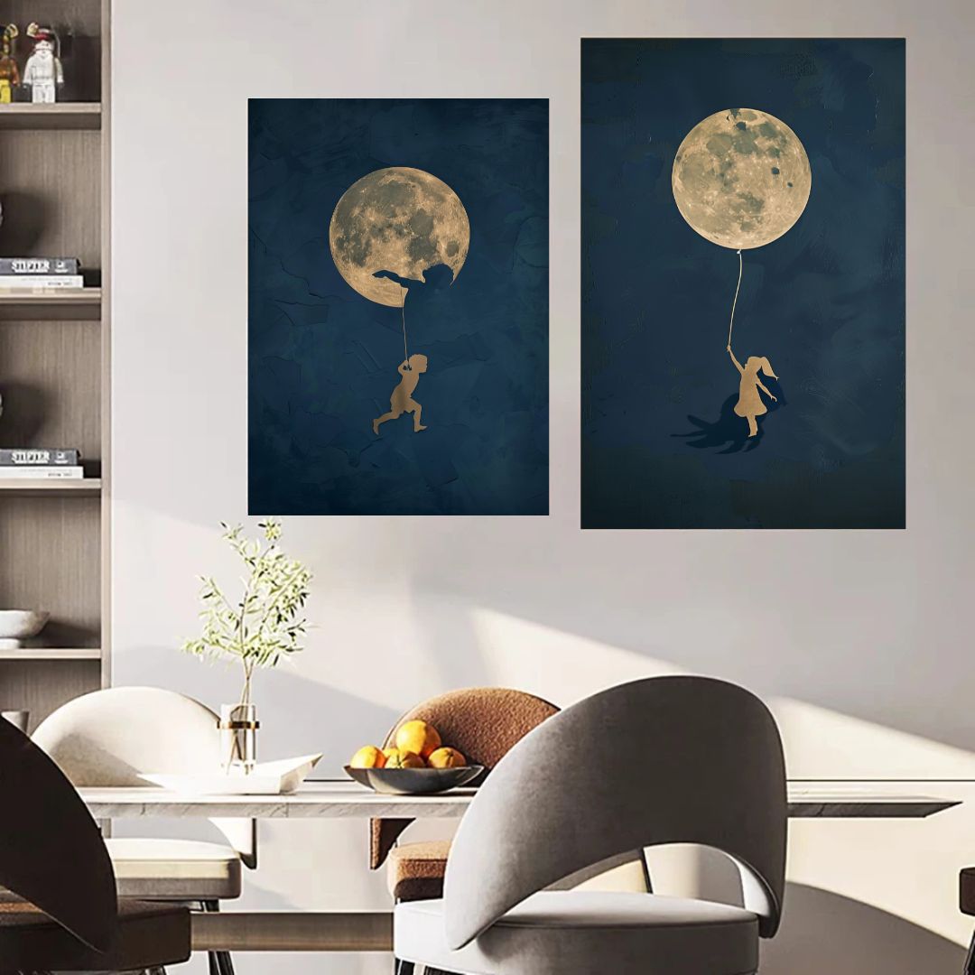 Two wall art prints of a child running towards a moon and a child holding a moon balloon in a modern dining room.